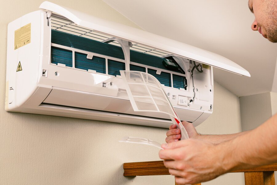 male-technician-cleaning-air-conditioner-indoors_93200-2299